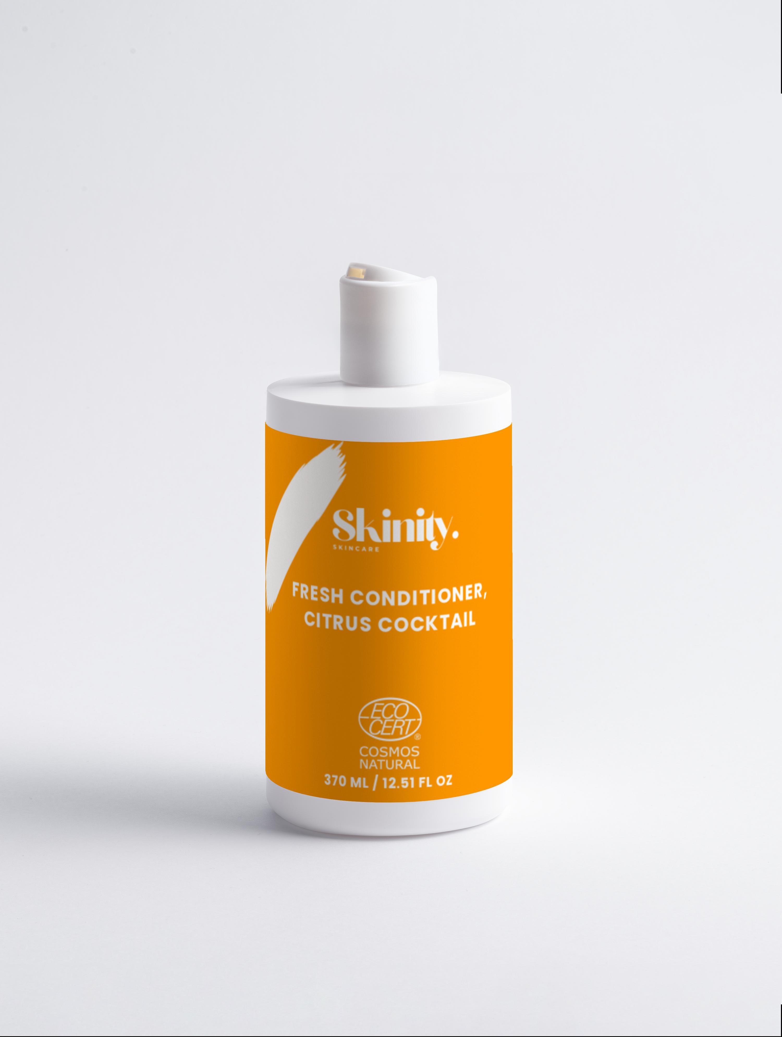 Fresh Conditioner Citrus Cocktail product bottle with vibrant orange label for nourishing hair care.