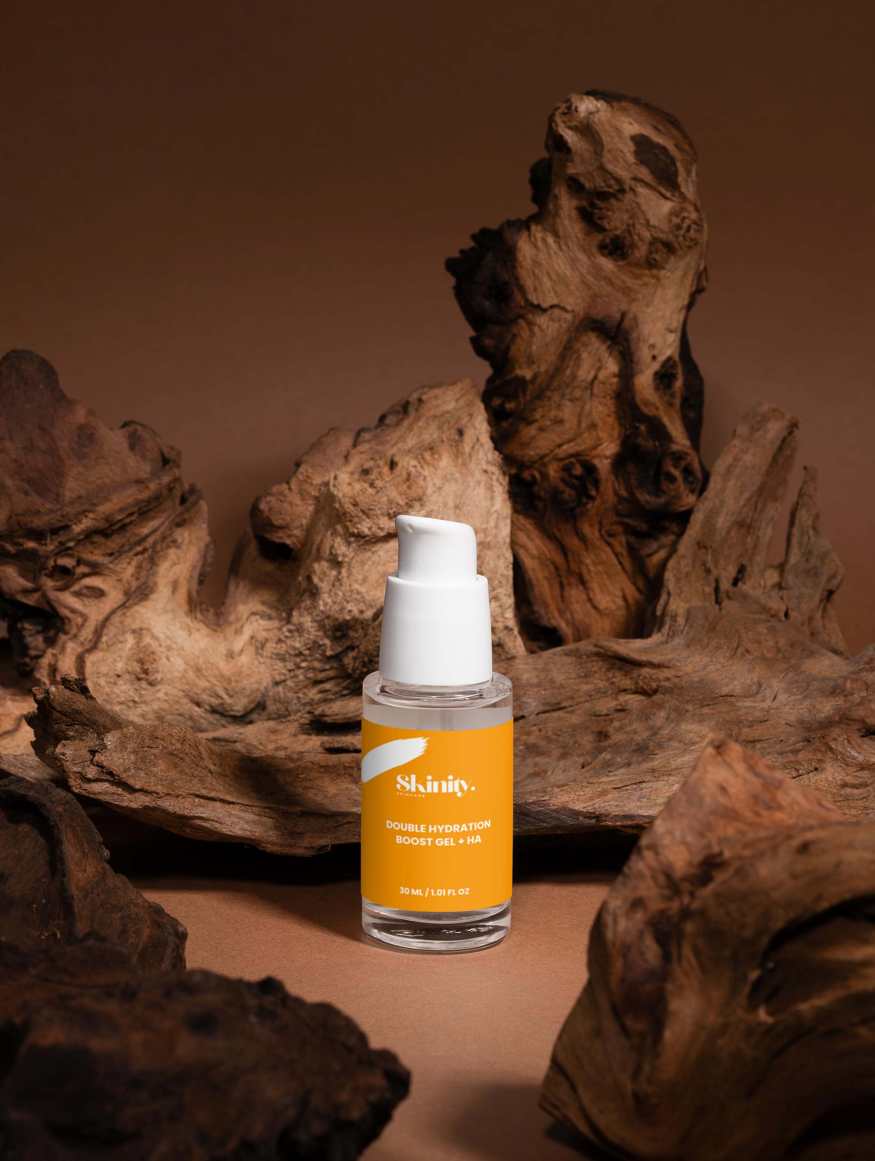 Double Hydration Boost Gel + HA bottle on textured wood background showcasing skincare product.