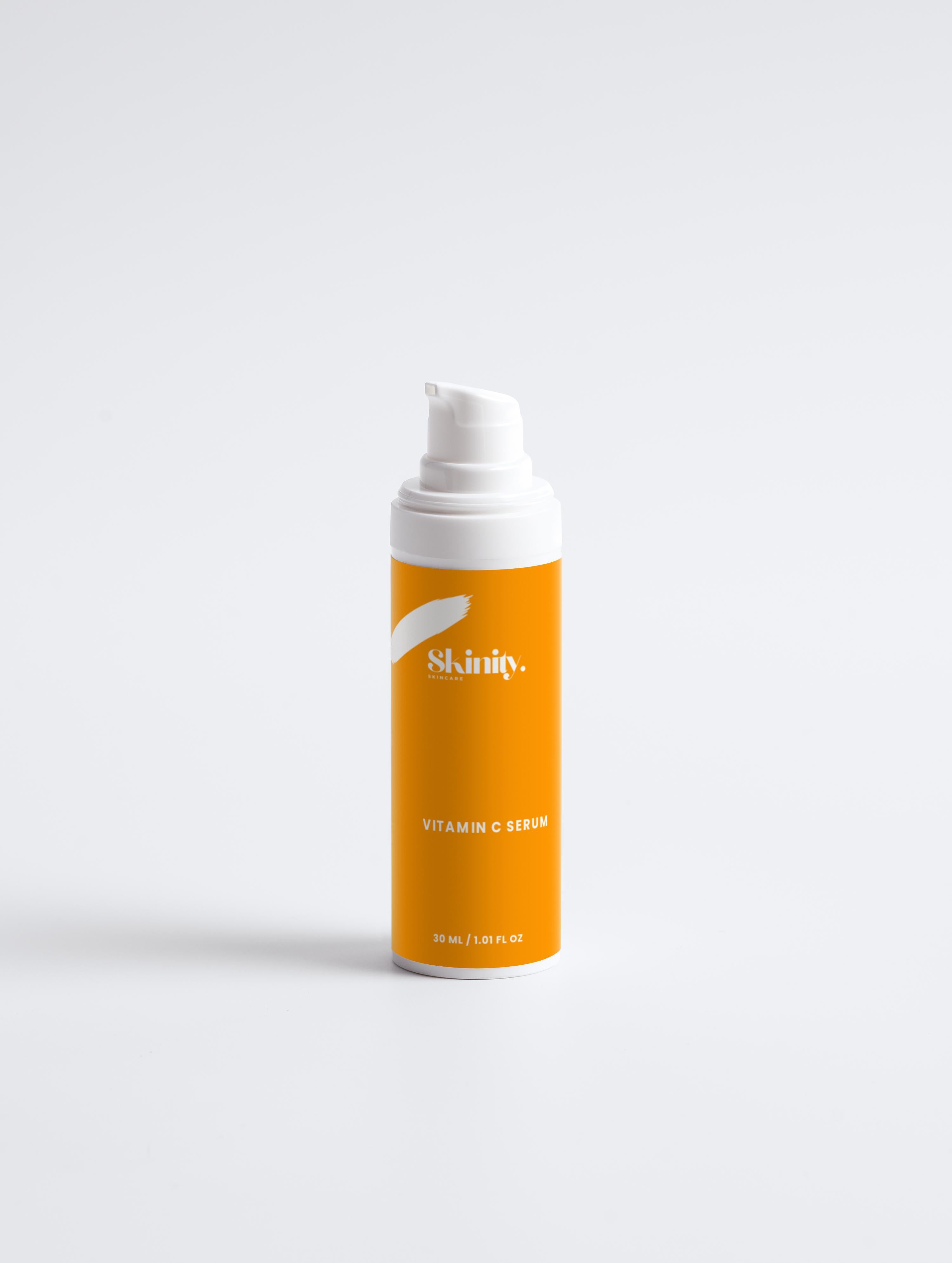 Vitamin C Serum for all skincare in a bright orange bottle with pump dispenser.