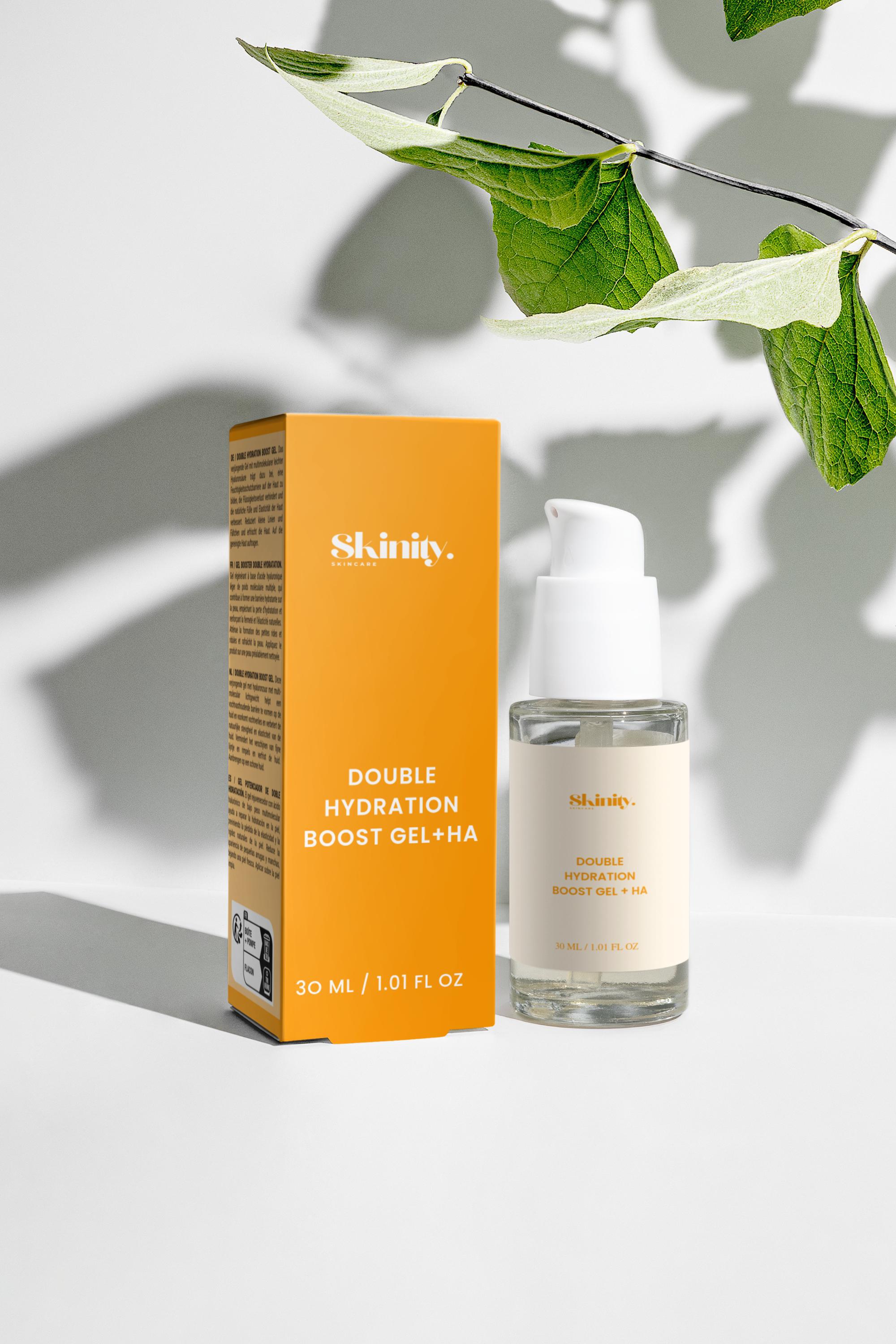 Skinity Double Hydration Boost Gel + HA packaging and bottle on a minimalistic background with green leaves.