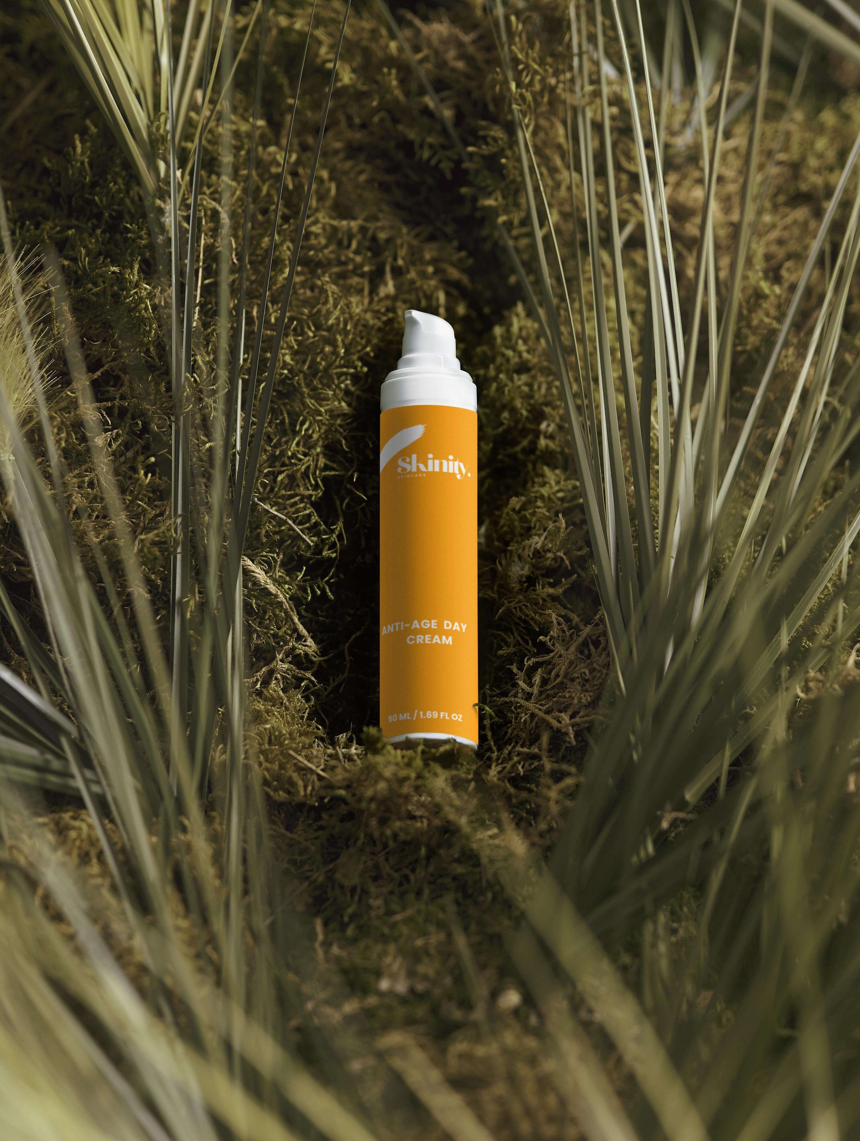 Anti-Age Day Cream For All Skin displayed in natural moss and palm leaves.