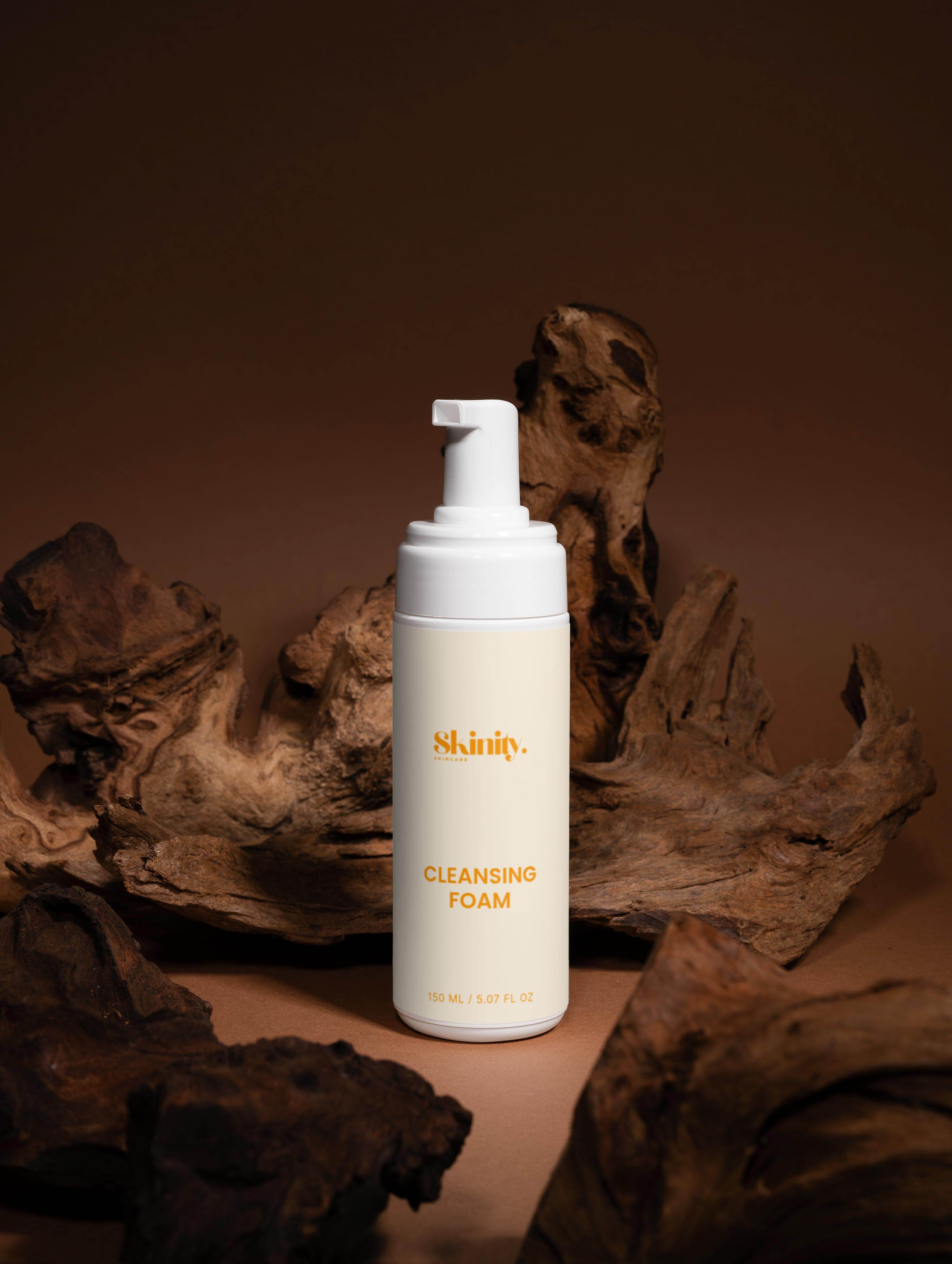 Cleansing Foam for all skincare in a bottle on a natural wood background, 150 mL, promoting fresh skin.