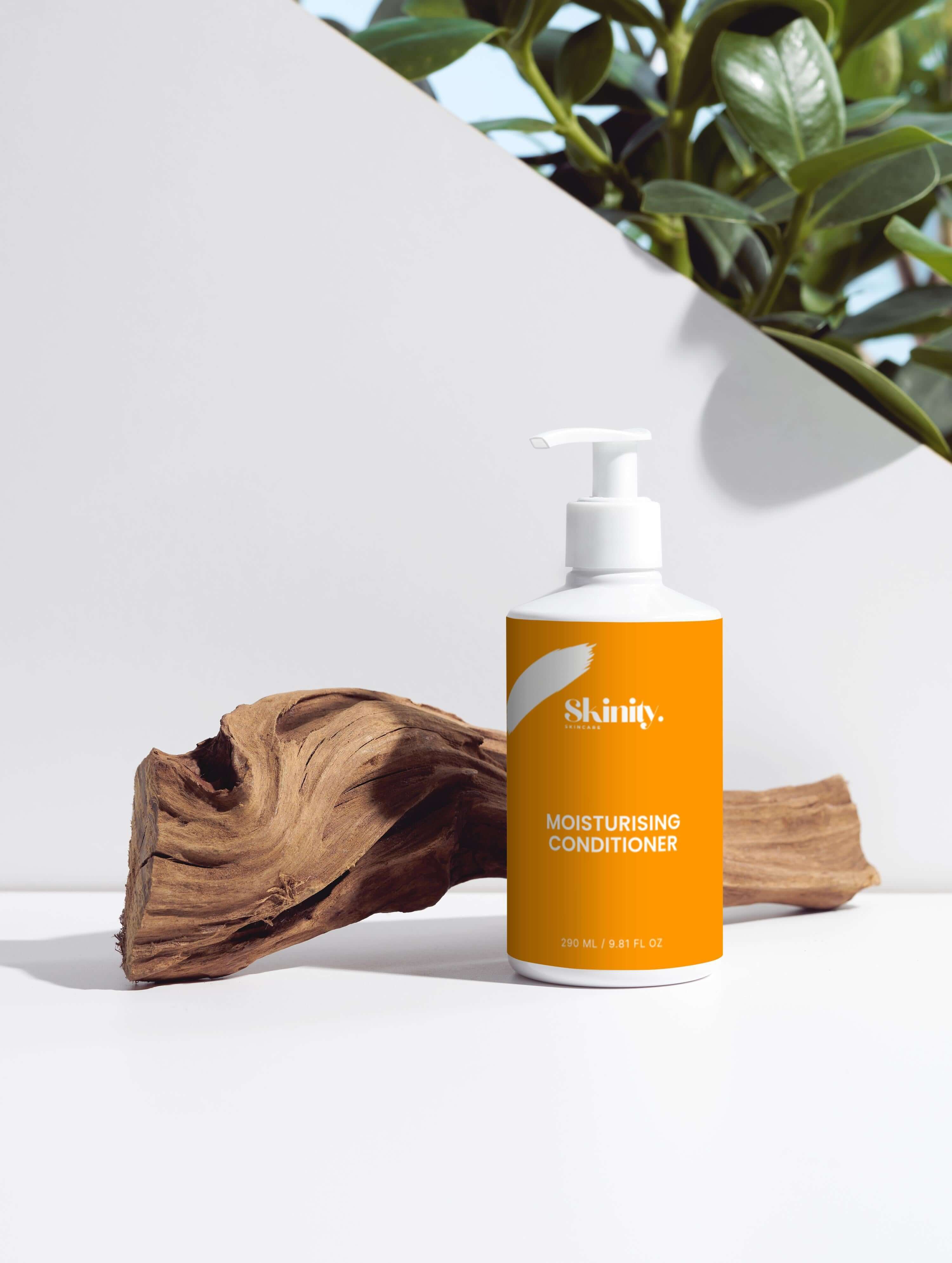 Moisturising Conditioner bottle on wooden display, certified vegan and cruelty-free, ideal for all hair types.