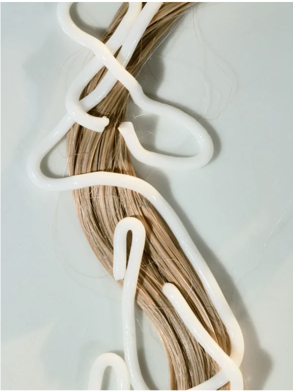 Gloss Conditioner Smoky Green Vetiver nourishing hair ends for shiny, silky, and smooth hair.