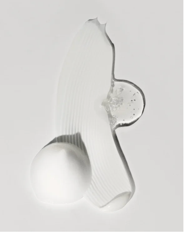 Hand and Body Wash Peppermint and Dark Cedar creamy texture with bubbles on a light background.