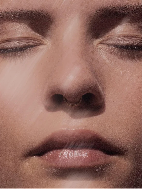 Close-up of a woman with a serene expression showcasing healthy skin, perfect for promoting Natural Retinol Alternative Oil Serum.