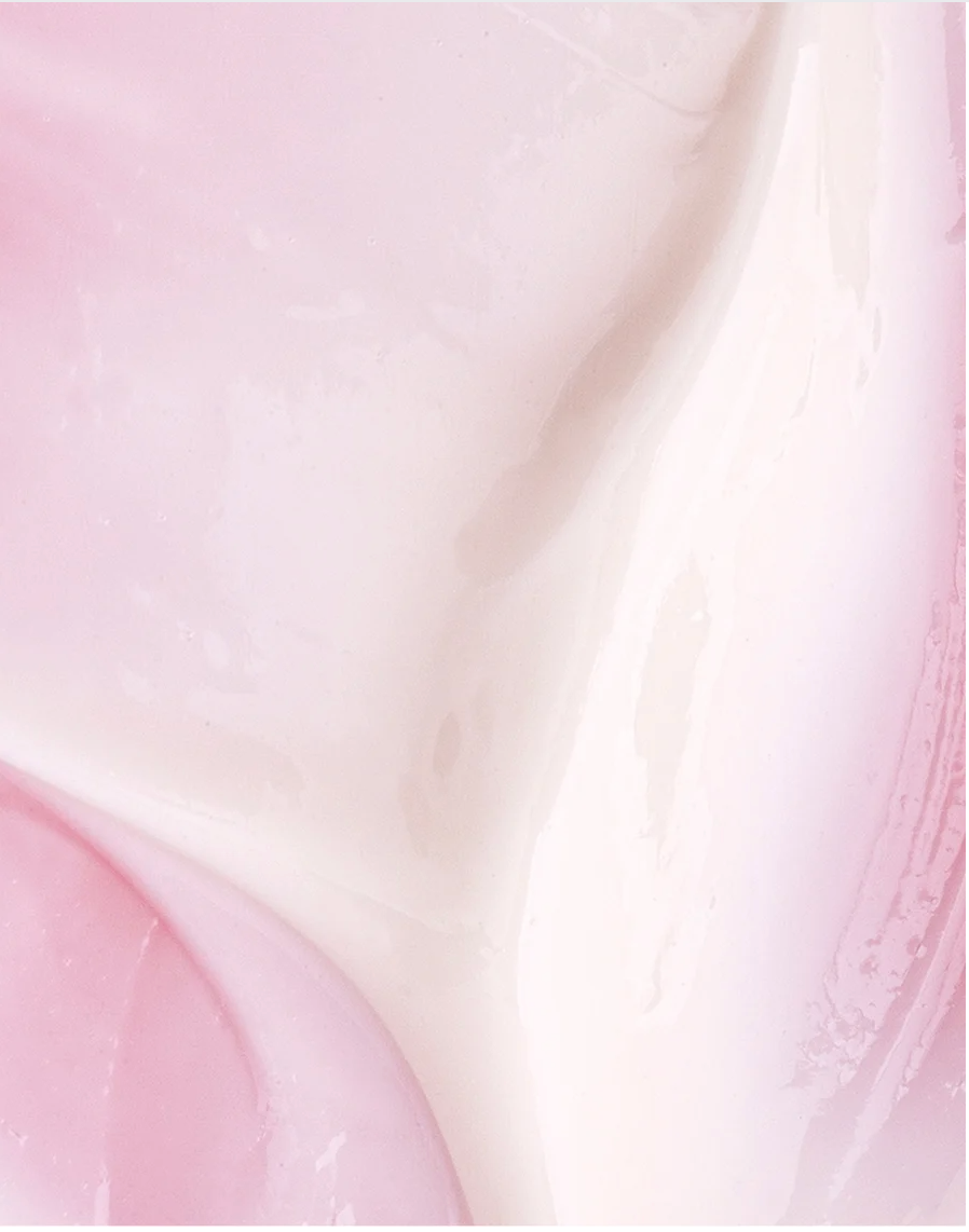 Retinol Alternative Serum For All Skin close-up texture with smooth pink and white cream, highlighting its lightweight and gentle formula.