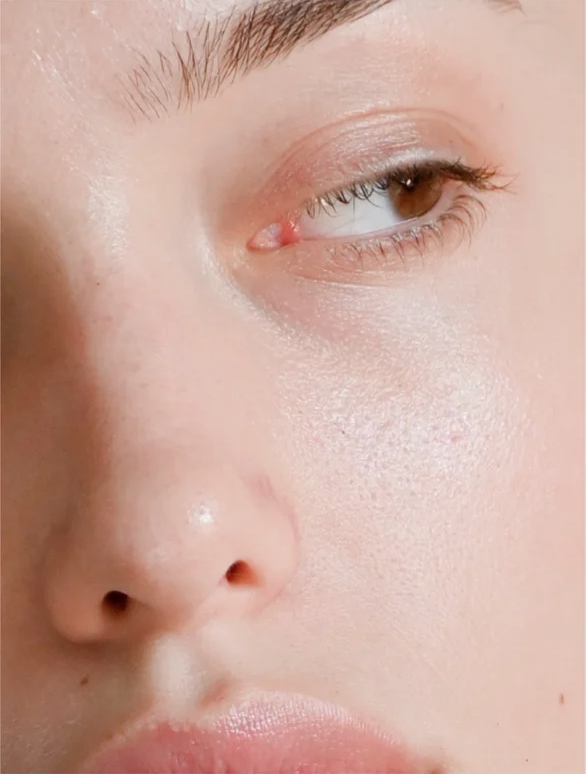 Close-up of a person's face showcasing radiant skin, ideal for product promotion of retinol alternative moisturizer.