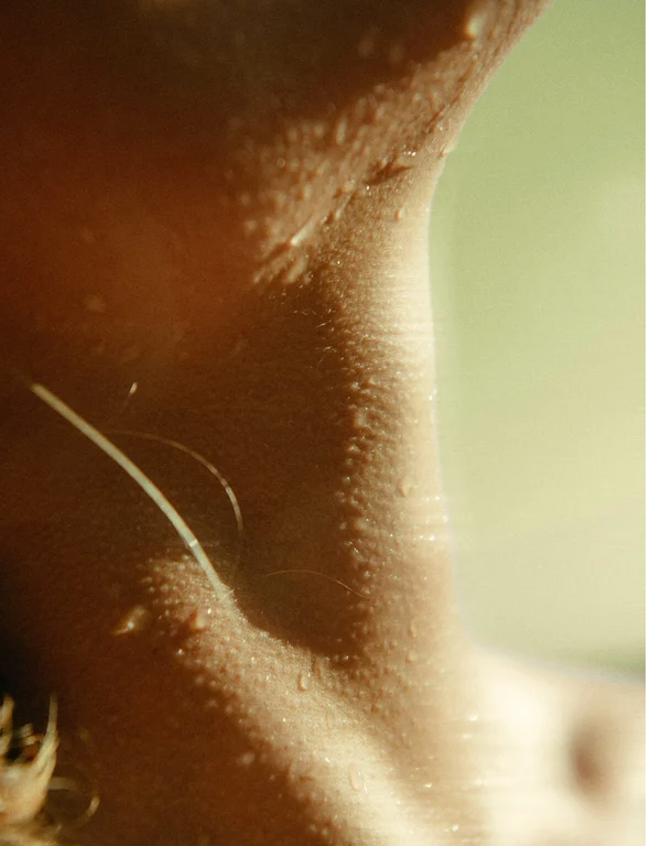 Close-up of skin showing texture and moisture, ideal for showcasing the benefits of Sensitive Skin Face and Body Cleanser.