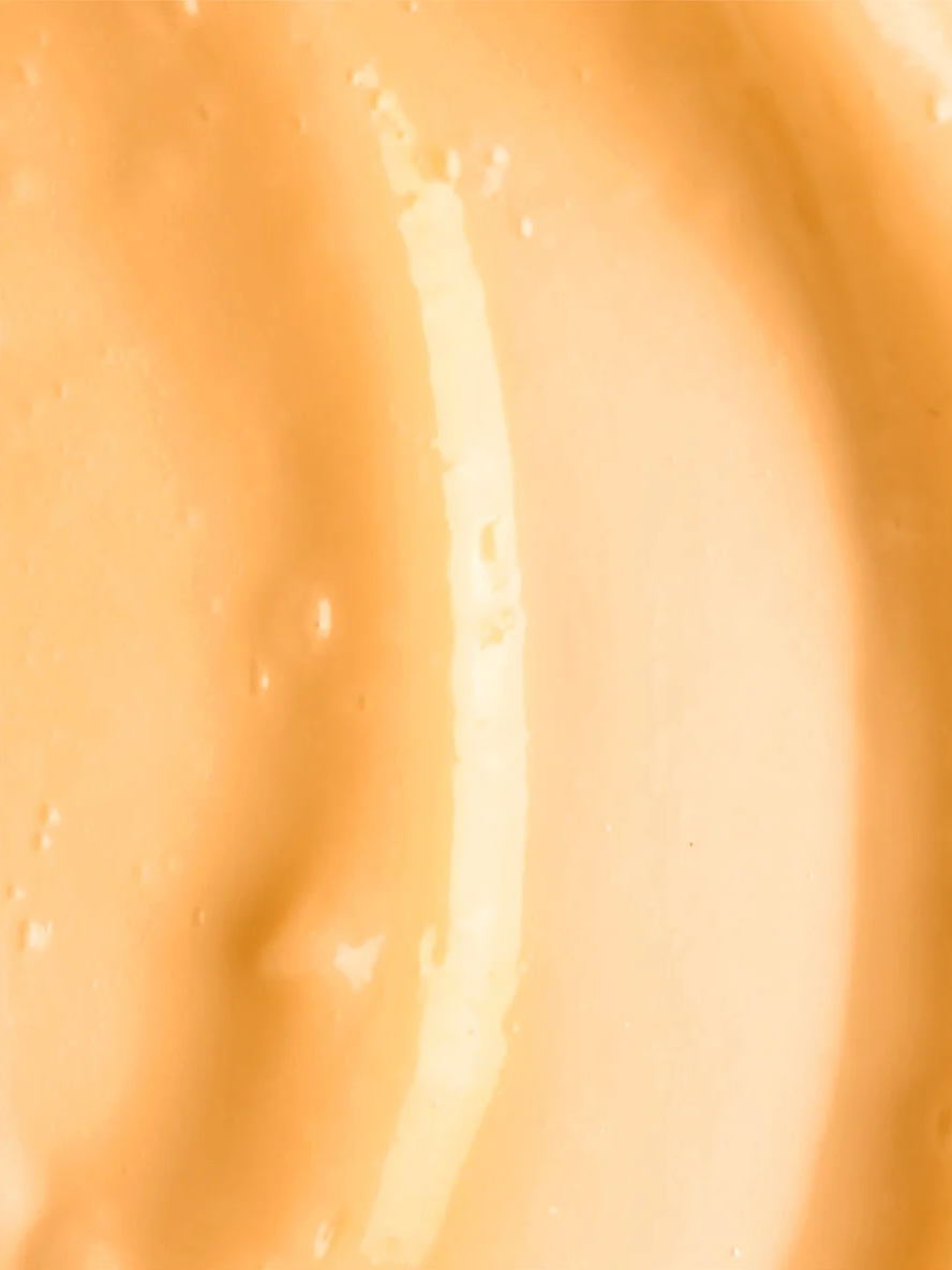 Kojic Acid Dark Spot Treatment close-up highlighting its smooth, creamy texture for effective skincare.