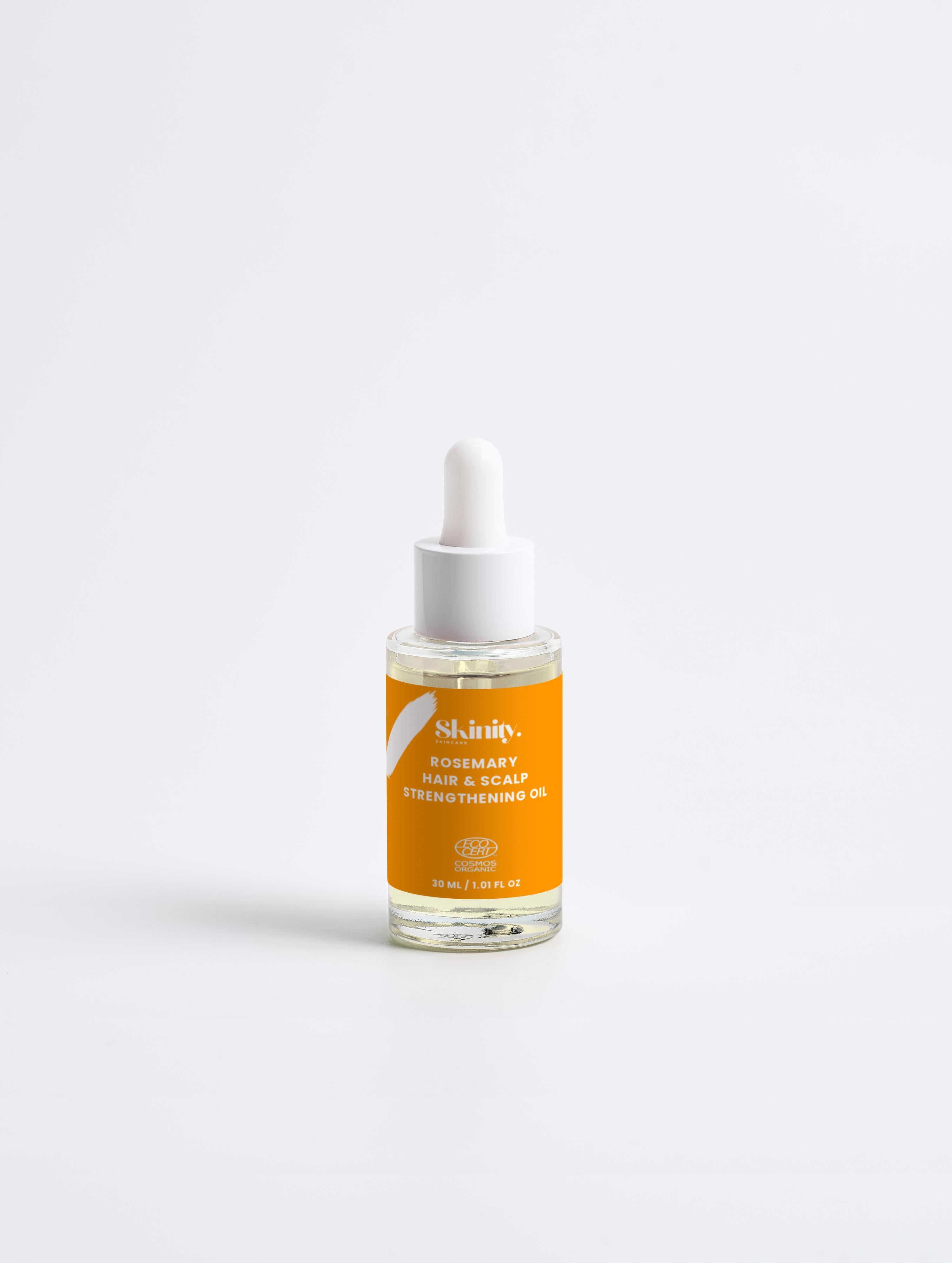 Rosemary Hair and Scalp Strengthening Oil in dropper bottle, nourishing scalp and improving hair resilience.