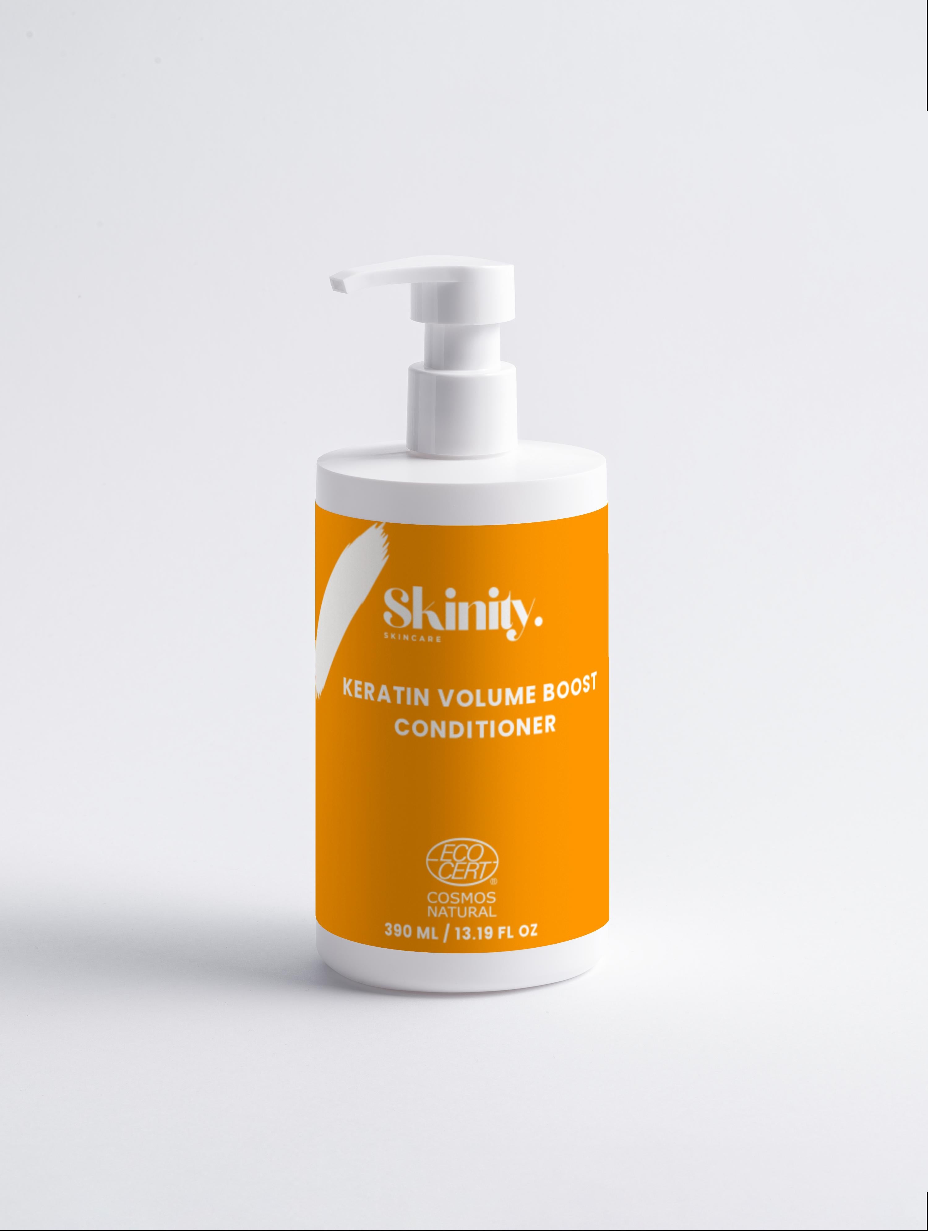 Keratin Volume Boost Conditioner bottle with pump in bright orange packaging for fuller and smoother hair.