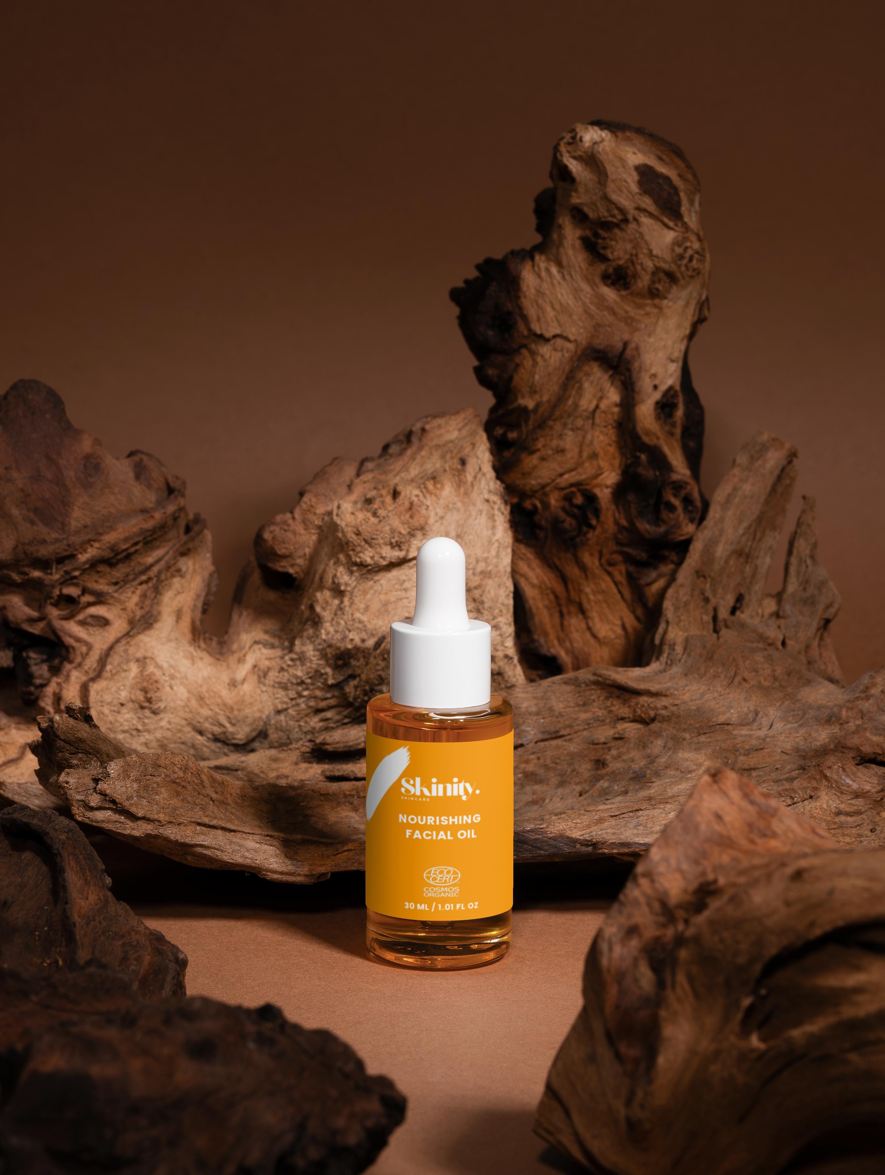 Nourishing Facial Oil For All Skin bottle placed on textured wood background, highlighting its eco-friendly features.