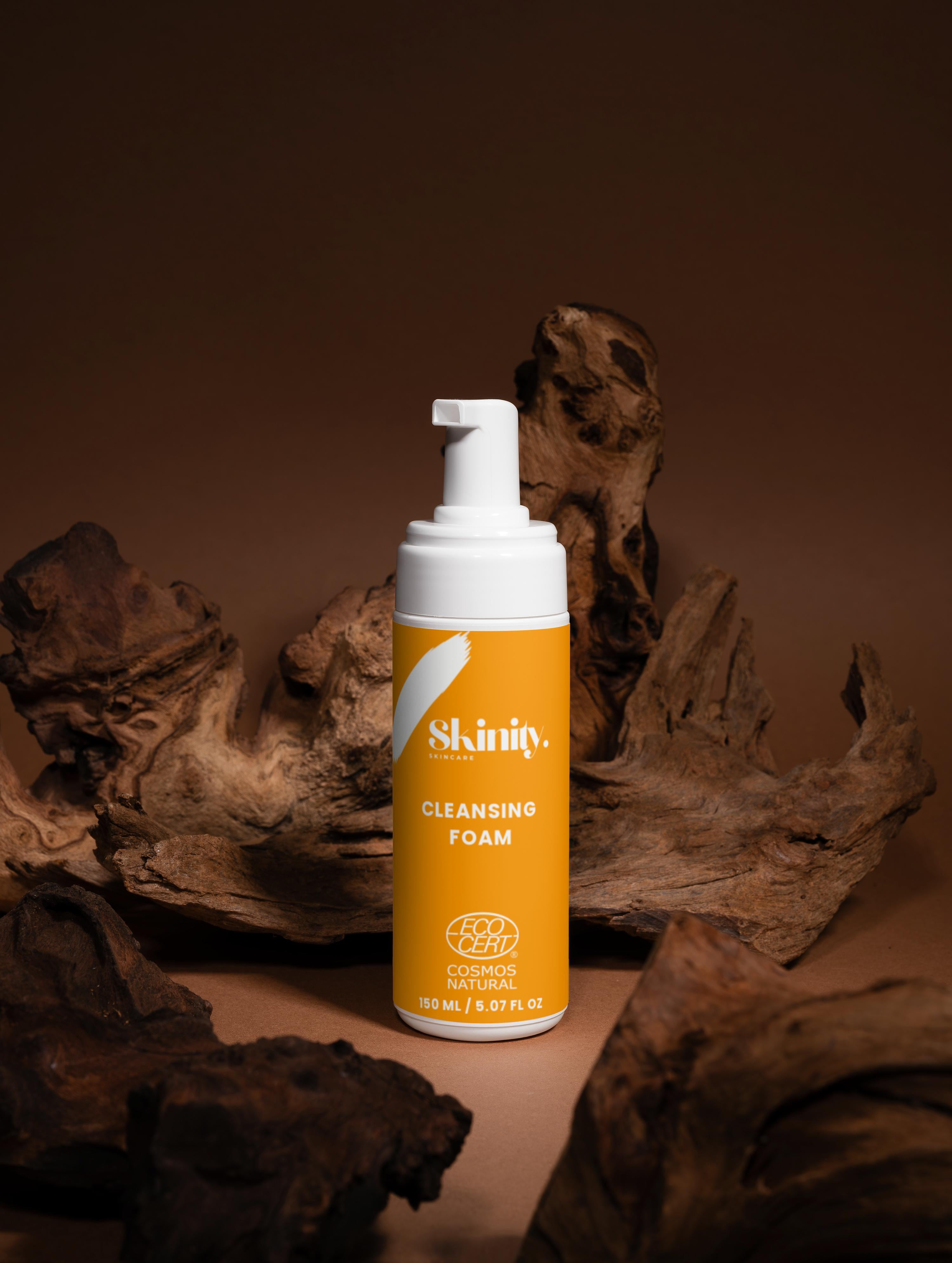 Cleansing Foam for all skincare bottle on a textured wooden background, showcasing its eco-friendly design.