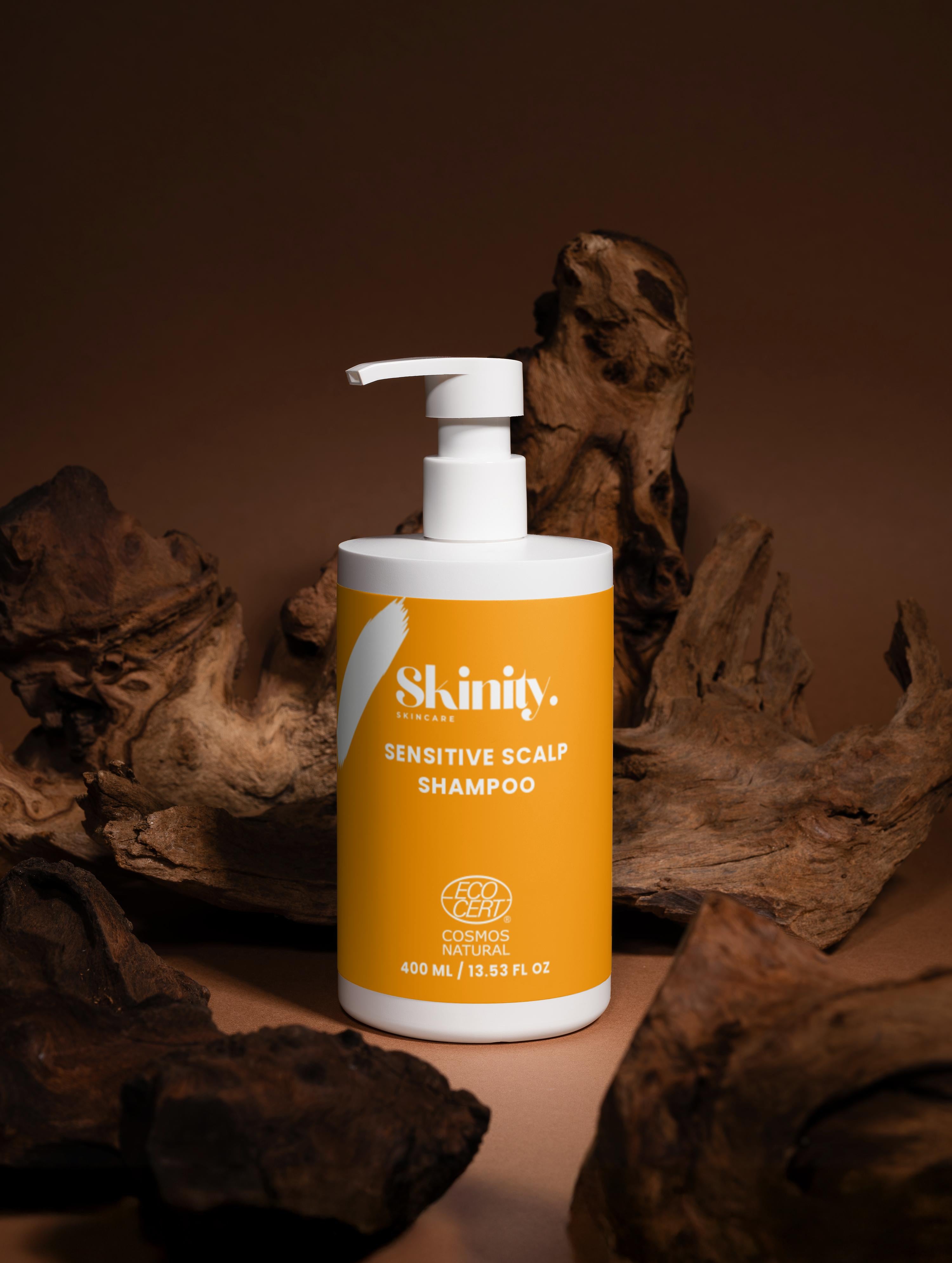 Skinity Sensitive Scalp Shampoo for all Hair Types on wooden background, ECOCERT certified, vegan and cruelty-free.