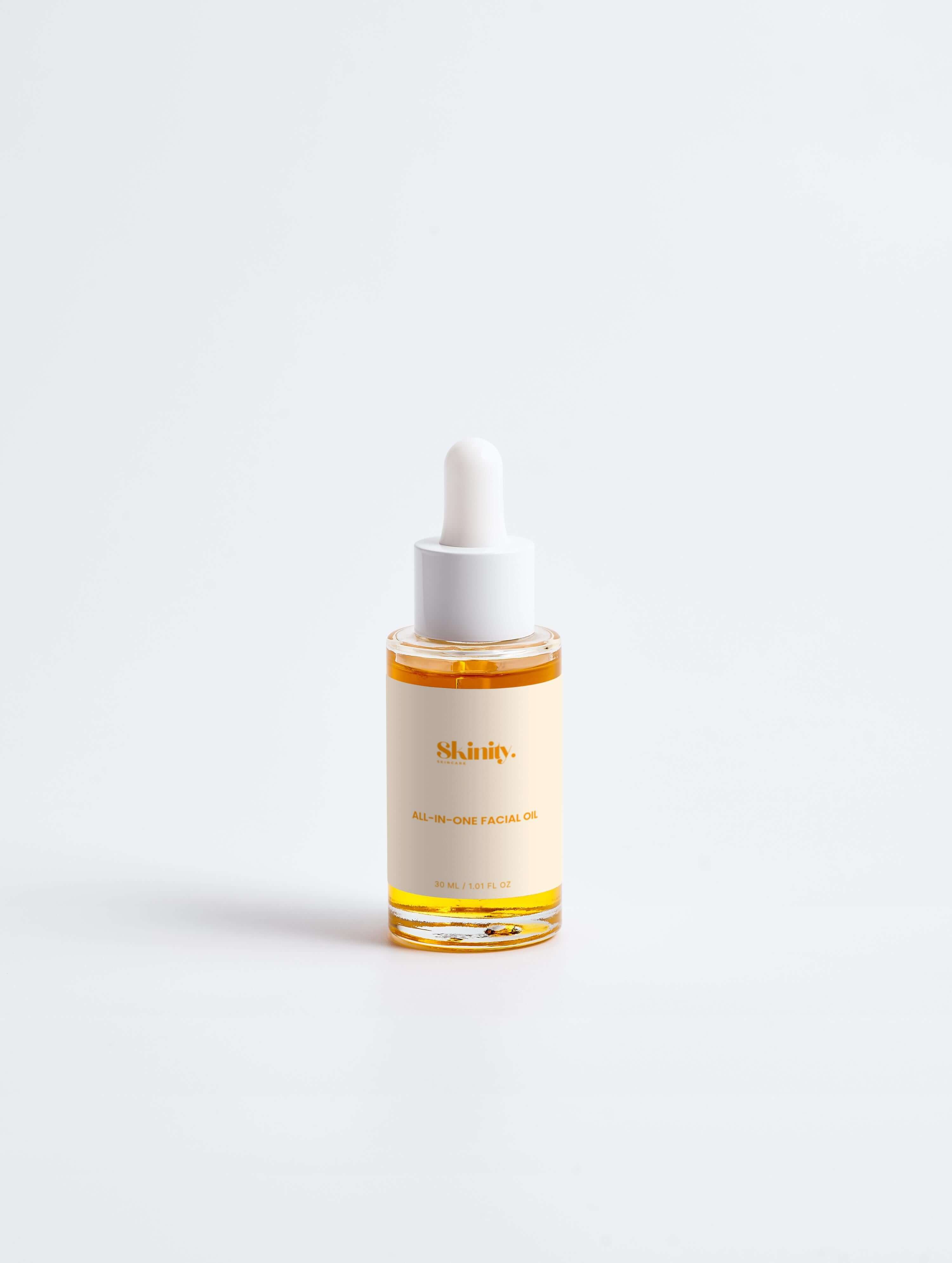 All-In-One Facial Oil for all skincare in a dropper bottle, perfect for nourishing and hydrating the skin.